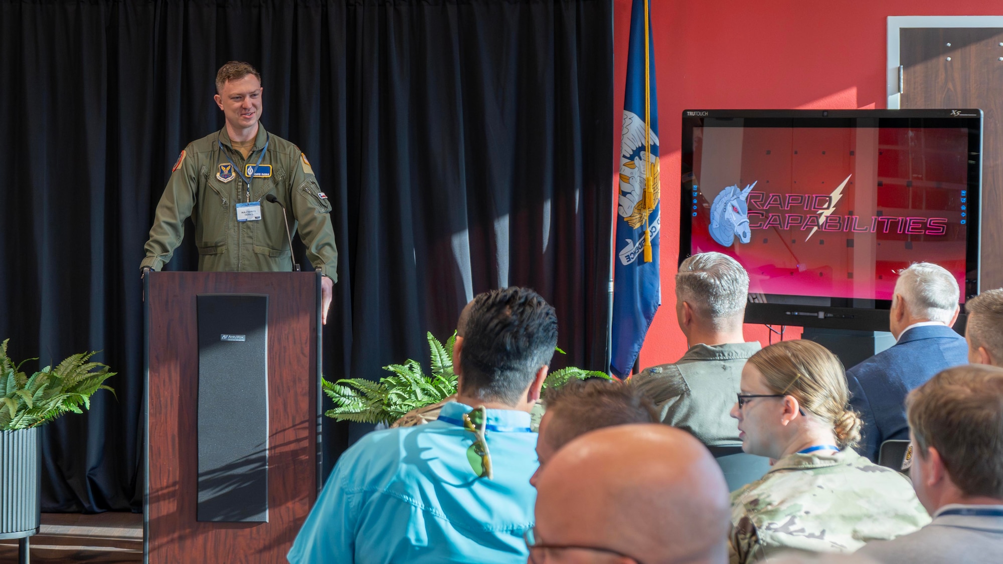 U.S. Air Force Maj. Travis Farris, branch chief of Air Force Global Strike Command’s Rapid Capabilities Division Program Requirements, speaks with attendees of the AFGSC Commercial Capabilities Showcase in Bossier City, Louisiana, on May 13, 2026. The two-day showcase brought together military leaders and commercial innovators to accelerate the integration of cutting-edge technology into the nation's long-range strike and deterrence missions, with a focus on several key areas critical to future operations, including quantum sensing, advanced manufacturing, deployable energy solutions, and next-generation defensive systems. (U.S. Air Force courtesy photo of Small Business Consulting Corporation)