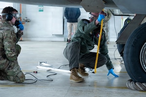 Airmen work on aircraft