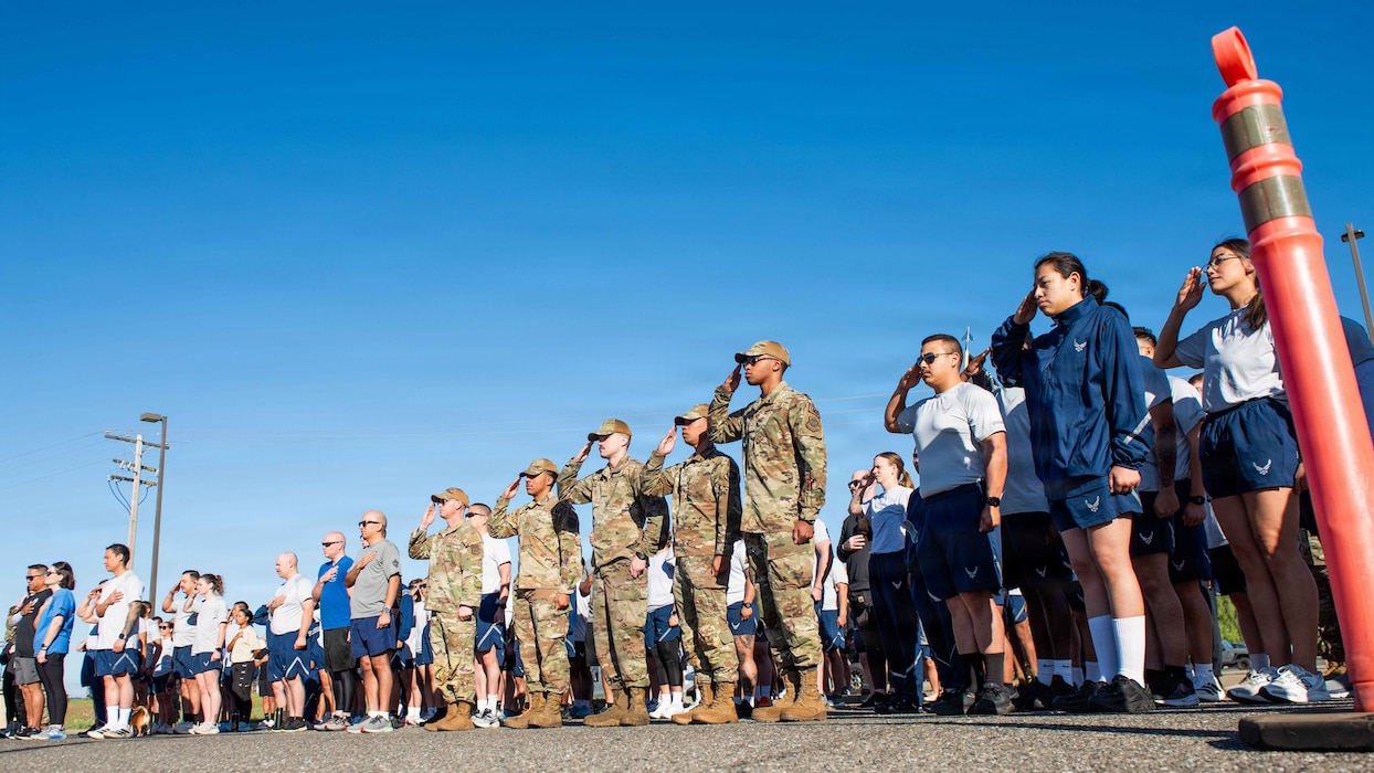 Airmen render honors during national anthem and memorial run