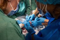 A group of U.S service members and Royal Moroccan Armed Forces perform care on a newborn baby after an emergency cesarean section during an African Lion 26 humanitarian civic assistance mission at El Faid, Morocco, April 30, 2026.