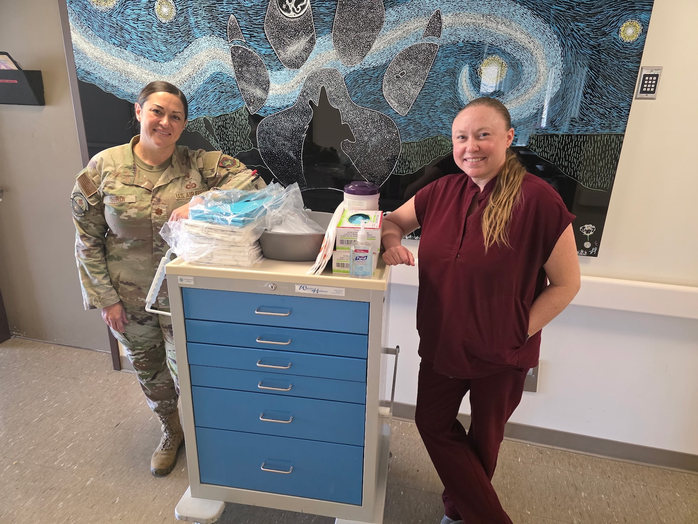 Maj. Bonnie L. Sgroi, an adult-gerontology clinical nurse specialist assigned to Inpatient Medical Services, and Joanna M. Davis, a wound care nurse at David Grant Medical Center, pose with wound care and pressure injury prevention supplies at Travis Air Force Base, Calif., May 2026. The Wound Care Optimization Team supports patient-centered care initiatives focused on wound prevention, early intervention and improved recovery outcomes across the medical center. (U.S. Air Force)