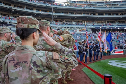 U.S. Air National Guard Staff Sgt. Andrew Wolfe throws the ceremonial first pitch during the Washington Nationals National Guard Appreciation Game at Nationals Park in Washington, D.C., May 18, 2026.
