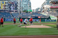 U.S. Air National Guard Staff Sgt. Andrew Wolfe throws the ceremonial first pitch during the Washington Nationals National Guard Appreciation Game at Nationals Park in Washington, D.C., May 18, 2026.