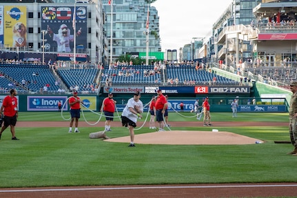 U.S. Air National Guard Staff Sgt. Andrew Wolfe throws the ceremonial first pitch during the Washington Nationals National Guard Appreciation Game at Nationals Park in Washington, D.C., May 18, 2026.