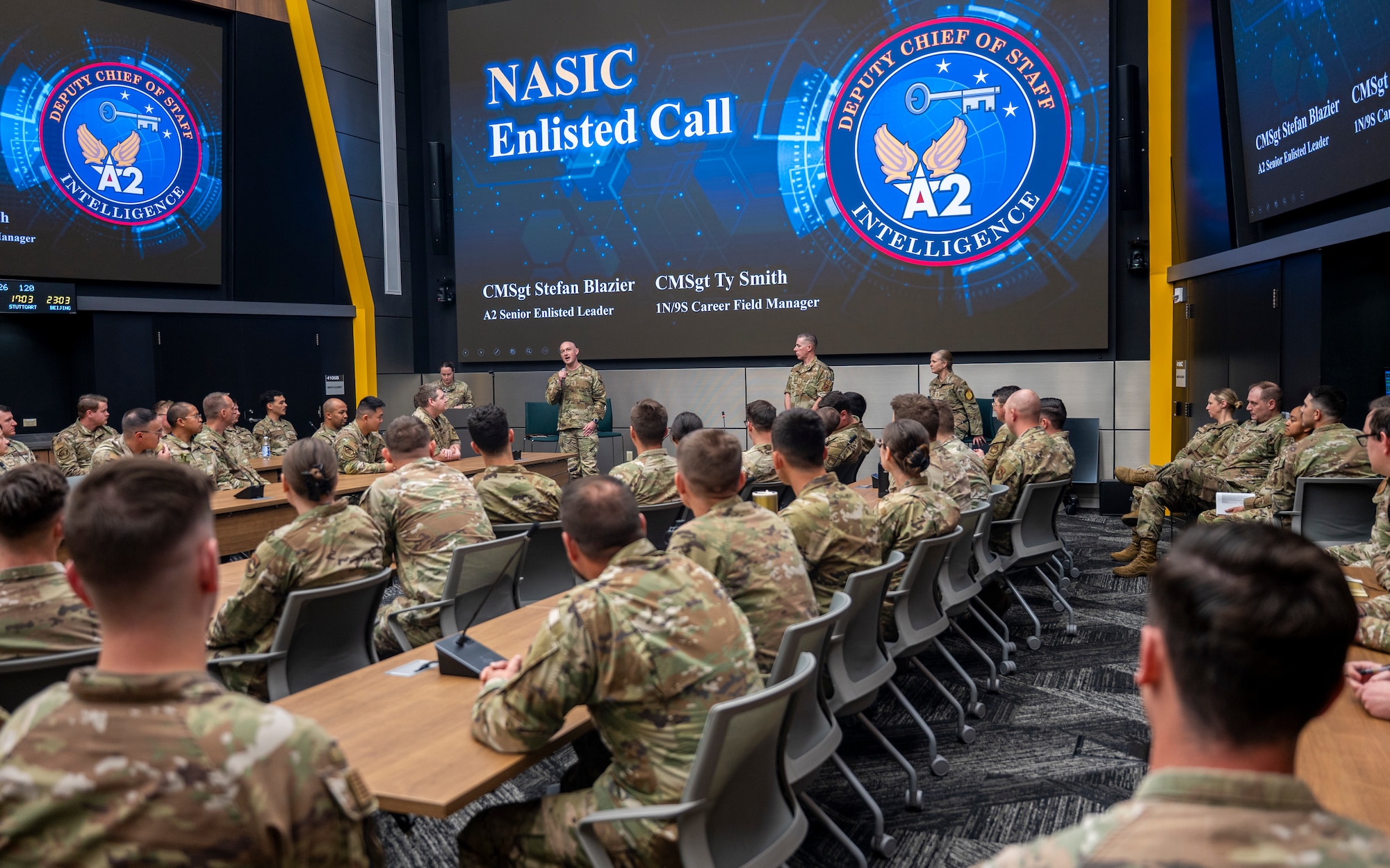 Chief Master Sgt. Stefan Blazier, Deputy Chief of Staff for Intelligence senior enlisted leader, and Chief Master Sgt. Tyler Smith, 1N/9L0/9S1 career field manager, addresses a crowd of intelligence professionals during an enlisted all-call while visiting the National Air and Space Intelligence Center at Wright-Patterson Air Force Base, Ohio, April 30, 2026.