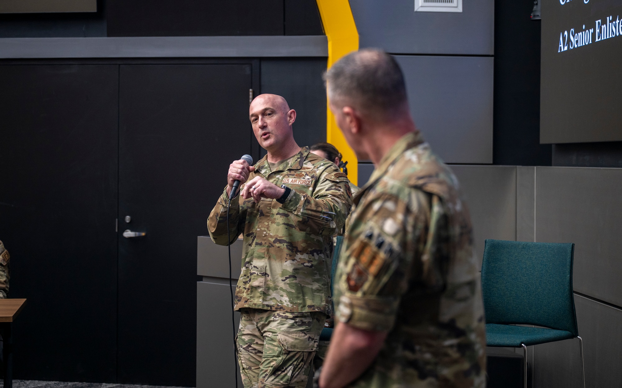 Chief Master Sgt. Stefan Blazier, Deputy Chief of Staff for Intelligence senior enlisted leader, and Chief Master Sgt. Tyler Smith, 1N/9L0/9S1 career field manager, engages in discussions regarding the future of military intelligence during an enlisted all-call while visiting the National Air and Space Intelligence Center at Wright-Patterson Air Force Base, Ohio, April 30, 2026.