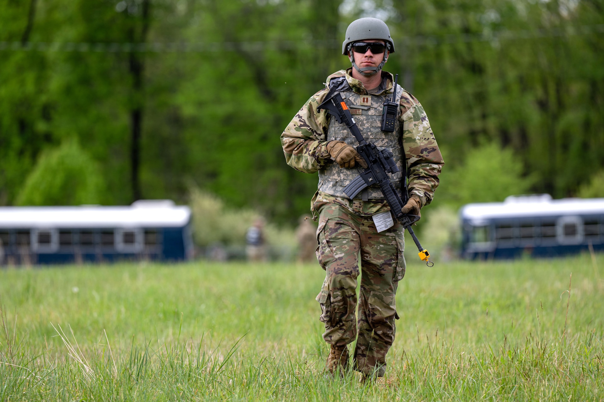 U.S. Air Force Capt. Cameron Hamnquist, 89th Operational Support Squadron weather flight commander, conducts a perimeter check during the 316th Wing's Bivouac exercise at Fort Indiantown Gap, Pennsylvania, April 27, 2026. The action reinforced the importance of perimeter security and situational awareness in a field environment. (U.S. Air Force photo by Senior Airman Martha Moore)