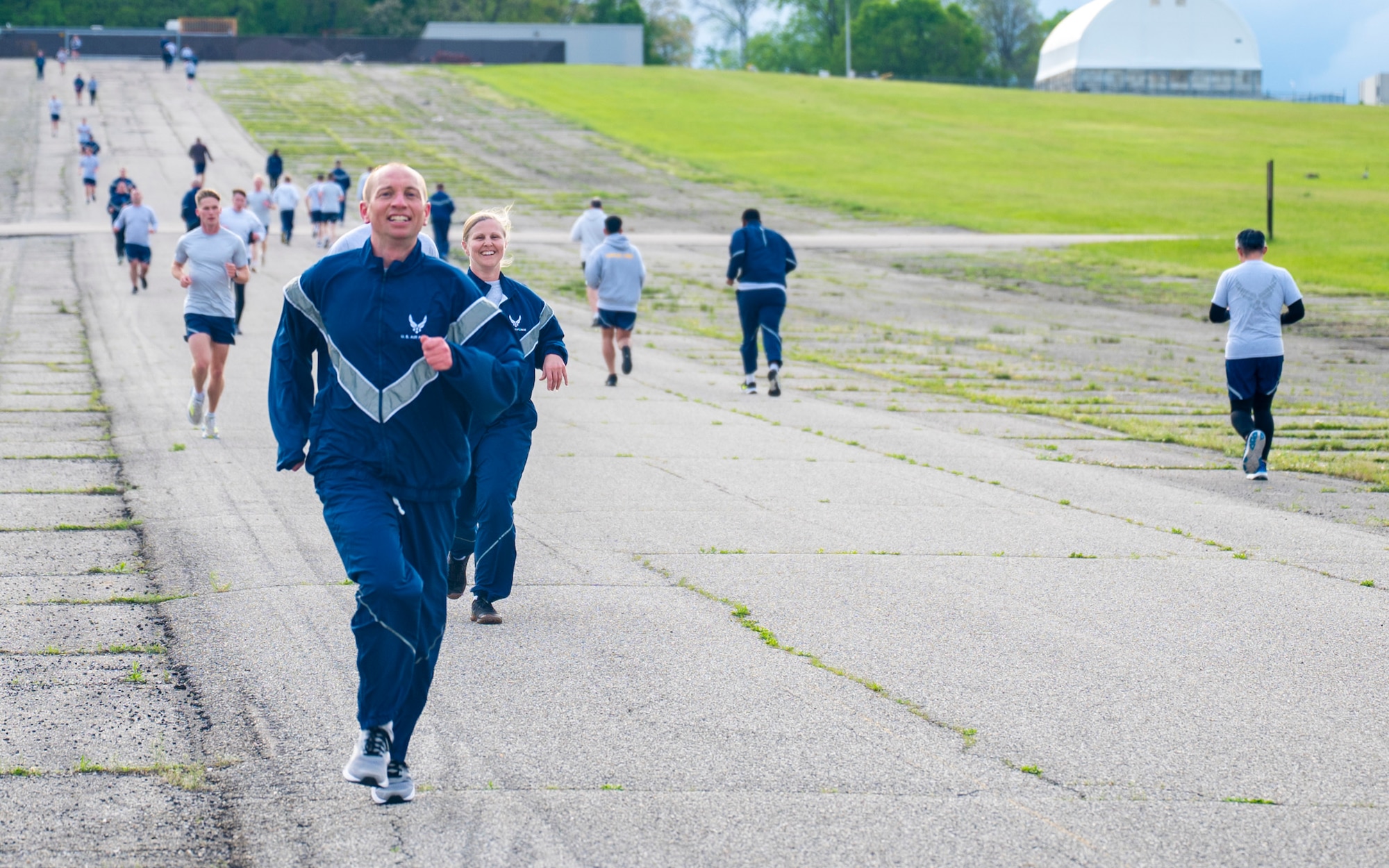 Demonstrating a "fit to fight" mentality, Chief Master Sgt. Stefan Blazier, Deputy Chief of Staff for Intelligence senior enlisted leader, participates in a physical training session with Airmen from the National Air and Space Intelligence Center at Wright-Patterson Air Force Base, Ohio, April 30, 2026.