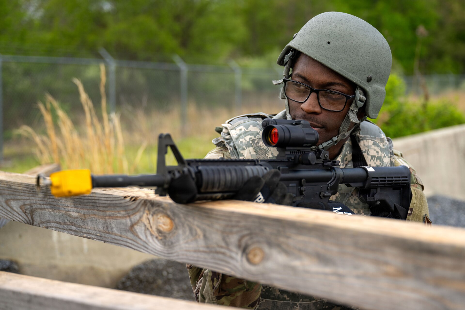 U.S. Air Force Senior Airman Jeremiah Davidson, 316th Civil Engineer Squadron heating, ventilation, and air conditioning technician, stands guard as a security forces augmentee during the 316th Wing's Bivouac exercise at Fort Indiantown Gap, Pennsylvania, April 27, 2026. The exercise tested Airmen’s ability to maintain security and protect personnel and resources in a dynamic environment. (U.S. Air Force photo by Senior Airman Martha Moore)