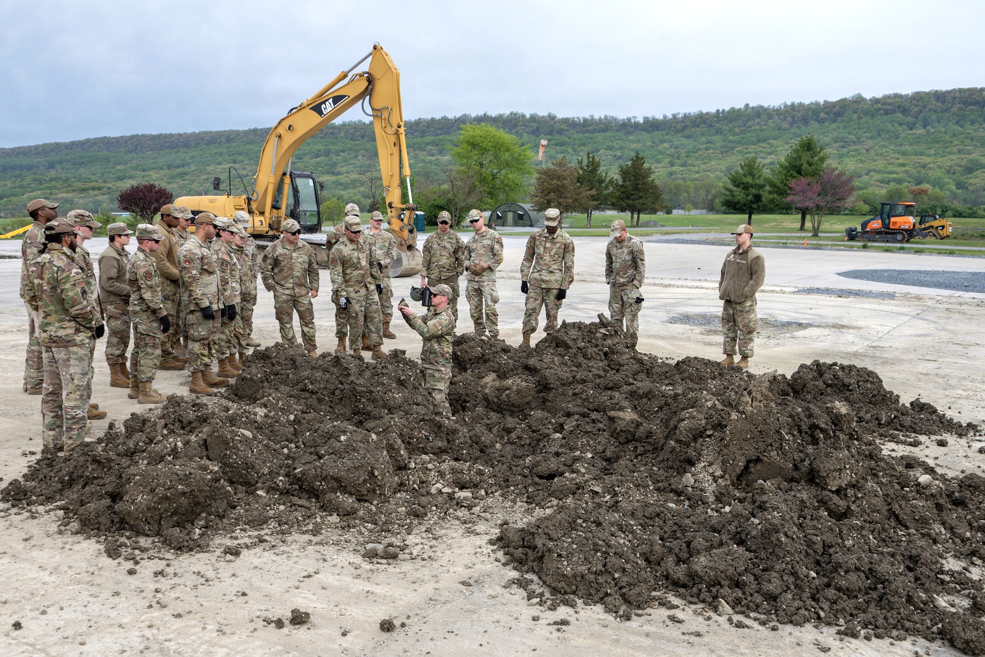 U.S. Air Force Airmen assigned to Joint Base Andrews, Maryland, conduct training for expeditionary airfield damage repair during the 316th Wing's Bivouac exercise at Fort Indiantown Gap, Pennsylvania, April 28, 2026. The exercise trains Airmen and highlights the diverse skill sets of multi-Air Force Specialty Code teamwork required to operate in a simulated contested environment. (U.S. Air Force photo by Staff Sgt. Aubree Owens)
