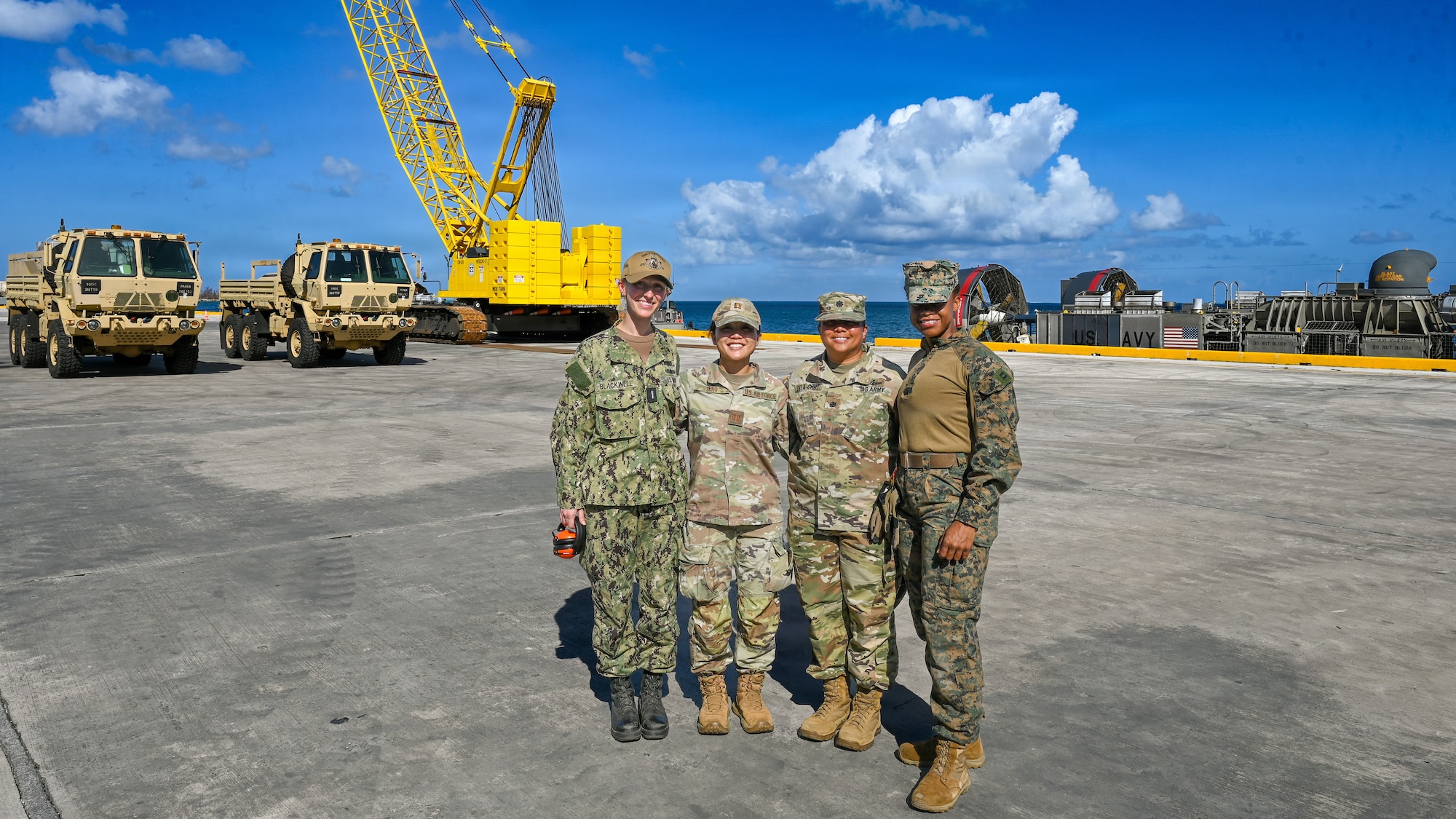Military members stand for a group photo