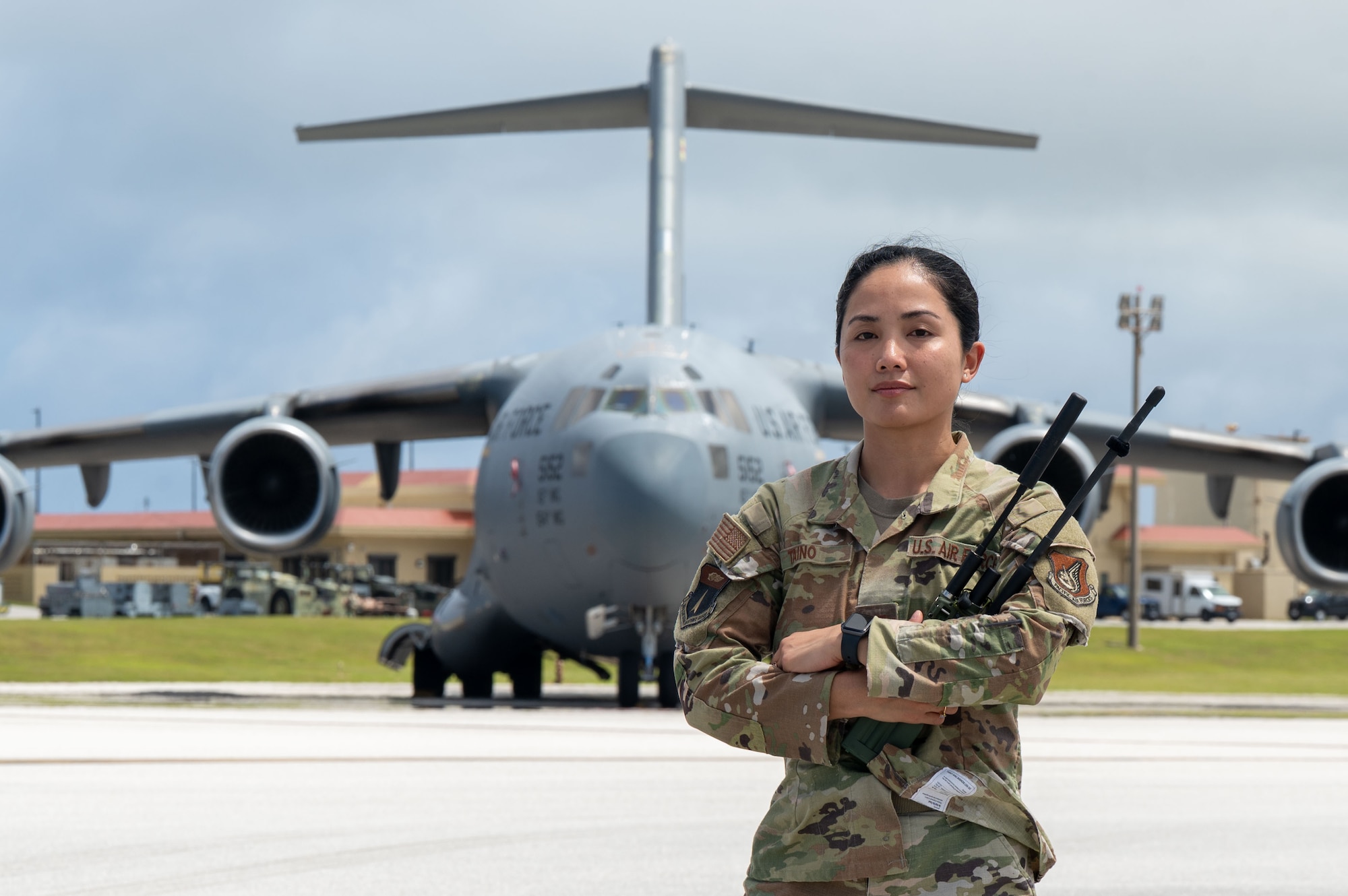 U.S. Air Force Capt. Lyza Taino, a landing zone safety officer with the 36th Contingency Response Squadron, stands in front of a C-17 Globe Master III
