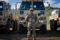U.S. Army Reserve 2nd Lt. Jerrid Igisaiar, 368th Military Police Company officer in charge, 9th Mission Support Command, poses in front of a vehicle loaded with tent supplies and commodities to be delivered to residents as part of Typhoon Sinlaku recovery efforts in Saipan, Commonwealth of the Northern Mariana Islands, May 18, 2026.