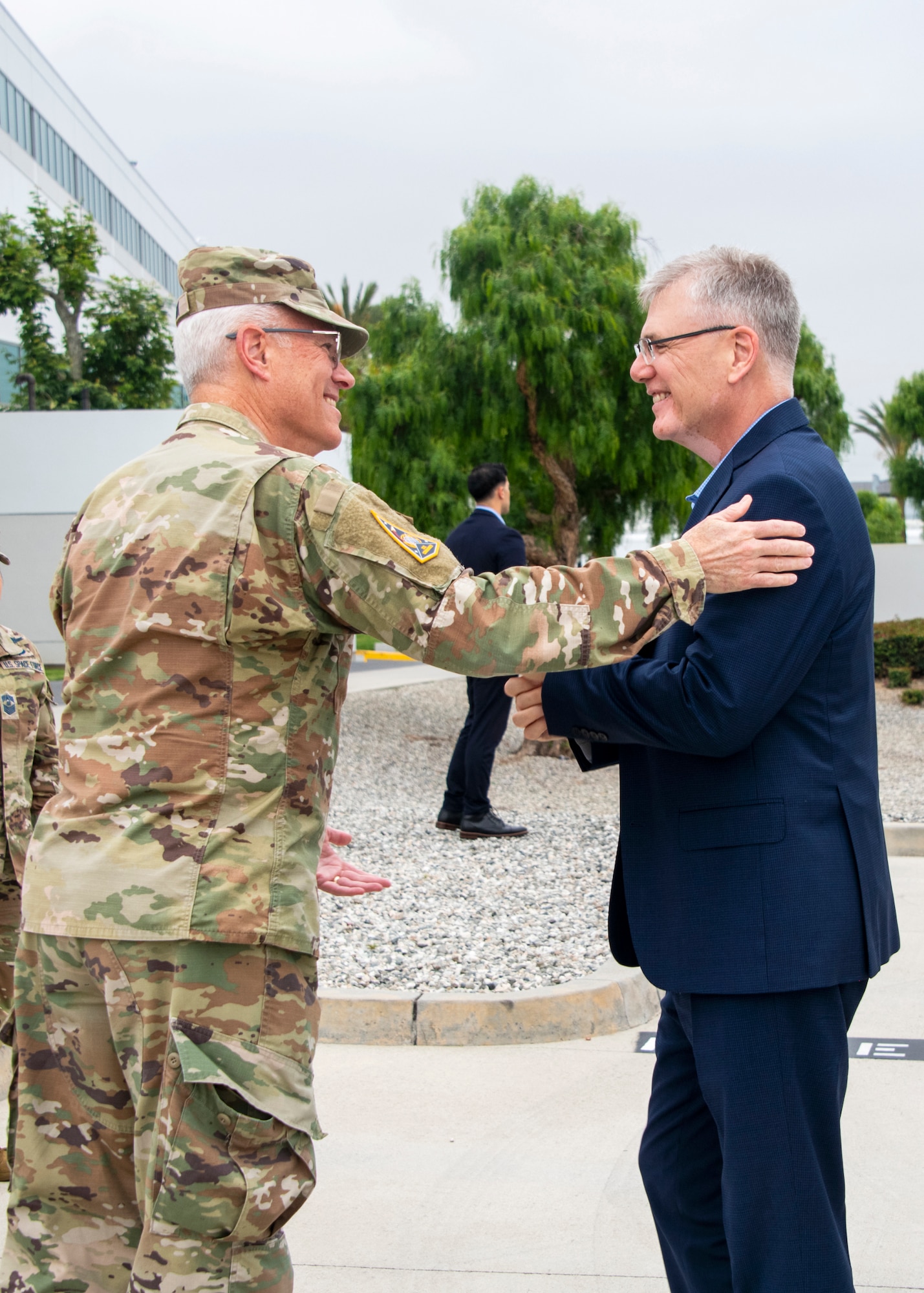 USSF Lt. Gen. Philip Garrant, commander of Space Systems Command (SSC), welcomes Secretary of the Air Force Troy Meink, to SSC headquarters at Los Angeles Air Force Base on May 14, 2026 in El Segundo, Calif. Meink’s visit included mission briefings, performance recognition, and inspirational discussion with early career Guardians and Airmen, followed by a series of industry meetings with local aerospace companies.  (Space Force photo by Van Ha)