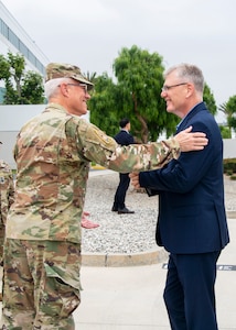 USSF Lt. Gen. Philip Garrant, commander of Space Systems Command (SSC), welcomes Secretary of the Air Force Troy Meink, to SSC headquarters at Los Angeles Air Force Base on May 14, 2026 in El Segundo, Calif. Meink’s visit included mission briefings, performance recognition, and inspirational discussion with early career Guardians and Airmen, followed by a series of industry meetings with local aerospace companies.  (Space Force photo by Van Ha)