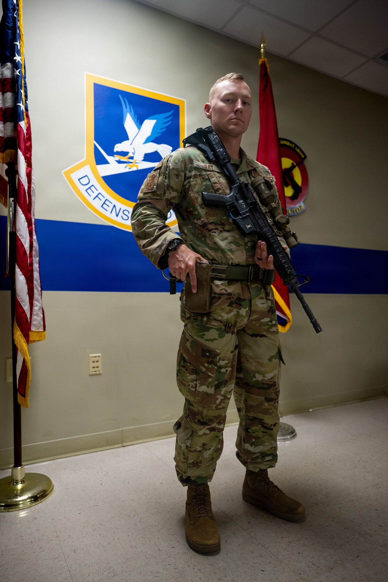 Airman poses with weapons