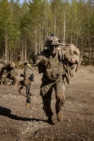 SGT Thomas Olsen with Charlie Company, 4th Battalion, 70th Armor Regiment, 1st Armored Brigade Combat Team, 1st Armored Division, rushes to establish a security posture during a multinational force-on-force exercise in Vuosanka Training Area, Finland, on May 18, 2026. From April 27 to May 31, 2026, U.S. and Allied forces will exercise NATO’s Eastern Flank Deterrence Initiative, demonstrating NATO’s ability to fight and win on the modern battlefield. Nearly 15,000 troops from eleven nations will train across the High North, Baltic region, and Poland, executing rapid maneuvers, air defense, counter-drone operations, and cyber defense to validate NATO’s regional defense plans in real time. This series of linked exercises, including Saber Strike, Immediate Response, and Swift Response, turns investment into capability. Soldiers integrate unmanned systems, AI-enabled command and control, and live data networks to move faster, decide faster, and fight more effectively across all domains. Sword 26 demonstrates how U.S. Army Europe and Africa drives transformation at scale while strengthening deterrence. Together with our Allies, we are building a unified, lethal force ready to defend NATO territory and respond to any threat. (U.S. Army Reserve photo by Capt. Christopher Gabayan)
