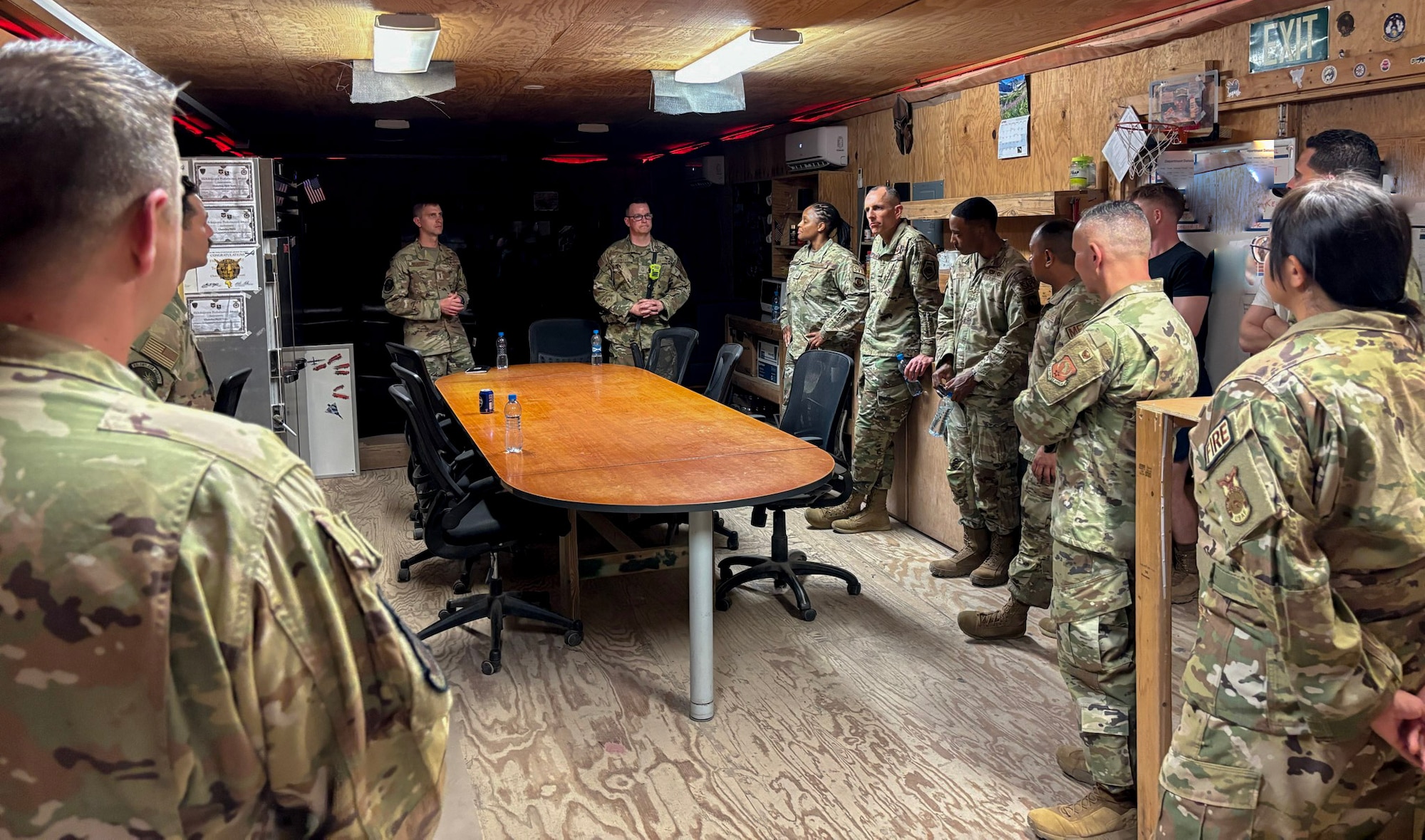 The 406th Air Expeditionary Wing command team meets with Airmen assigned to the Fire Team during an immersion tour at Chabelley Airfield, Djibouti, April 11, 2026. The 776th EABS firefighters run daily operations to maintain readiness in case of emergencies such as structure or aircraft fires, injury and other mishaps in a deployed environment (U.S. Air Force photo by Capt. Sarah Cap)