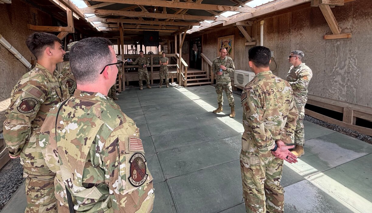 The 406th Air Expeditionary Wing command team meets with Airmen assigned to the Fire Team during an immersion tour at Chabelley Airfield, Djibouti, April 11, 2026. The 776th EABS firefighters run daily operations to maintain readiness in case of emergencies such as structure or aircraft fires, injury and other mishaps in a deployed environment (U.S. Air Force photo by Capt. Sarah Cap)