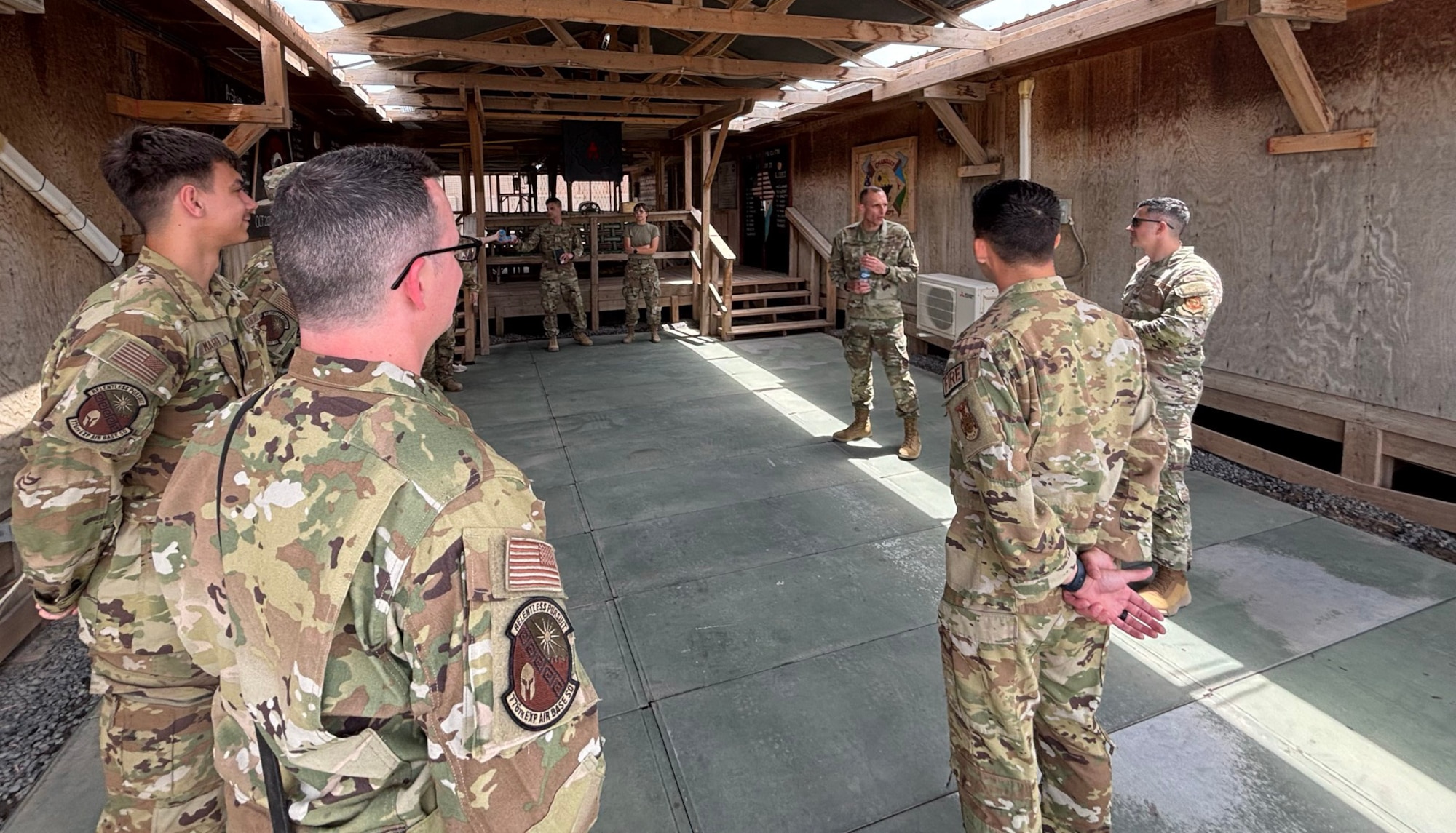The 406th Air Expeditionary Wing command team meets with Airmen assigned to the Fire Team during an immersion tour at Chabelley Airfield, Djibouti, April 11, 2026. The 776th EABS firefighters run daily operations to maintain readiness in case of emergencies such as structure or aircraft fires, injury and other mishaps in a deployed environment (U.S. Air Force photo by Capt. Sarah Cap)