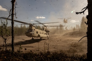 Two CH-47 Chinook helicopters from Bravo Company, 1st Battalion, 214th Aviation Regiment (General Support Aviation Battalion), 12th Combat Aviation Brigade, infill troops into a hasty landing zone during a multinational force-on-force exercise in Vuosanka Training Area, Finland, on May 18, 2026. From April 27 to May 31, 2026, U.S. and Allied forces will exercise NATO’s Eastern Flank Deterrence Initiative, demonstrating NATO’s ability to fight and win on the modern battlefield. Nearly 15,000 troops from eleven nations will train across the High North, Baltic region, and Poland, executing rapid maneuvers, air defense, counter-drone operations, and cyber defense to validate NATO’s regional defense plans in real time. This series of linked exercises, including Saber Strike, Immediate Response, and Swift Response, turns investment into capability. Soldiers integrate unmanned systems, AI-enabled command and control, and live data networks to move faster, decide faster, and fight more effectively across all domains. Sword 26 demonstrates how U.S. Army Europe and Africa drives transformation at scale while strengthening deterrence. Together with our Allies, we are building a unified, lethal force ready to defend NATO territory and respond to any threat. (U.S. Army Reserve photo by Capt. Christopher Gabayan)