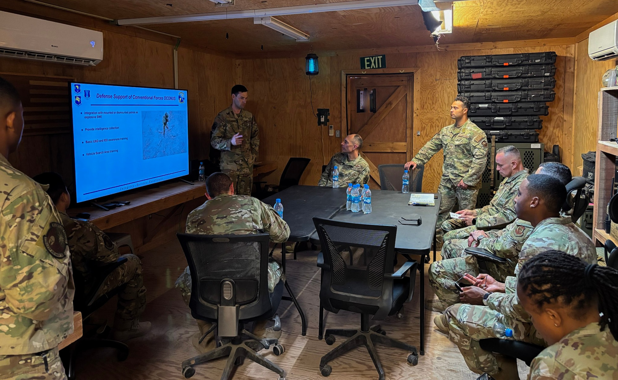 The 406th Air Expeditionary Wing command team receives a briefing from the 776th Expeditionary Air Base Squadron Explosive Ordnance Team during an immersion tour at Chabelley Airfield, Djibouti, April 11, 2026. The mission of the 776th EABS is to provide airpower from a secure, durable and flexible installation. (U.S. Air Force photo by Capt. Sarah Cap)