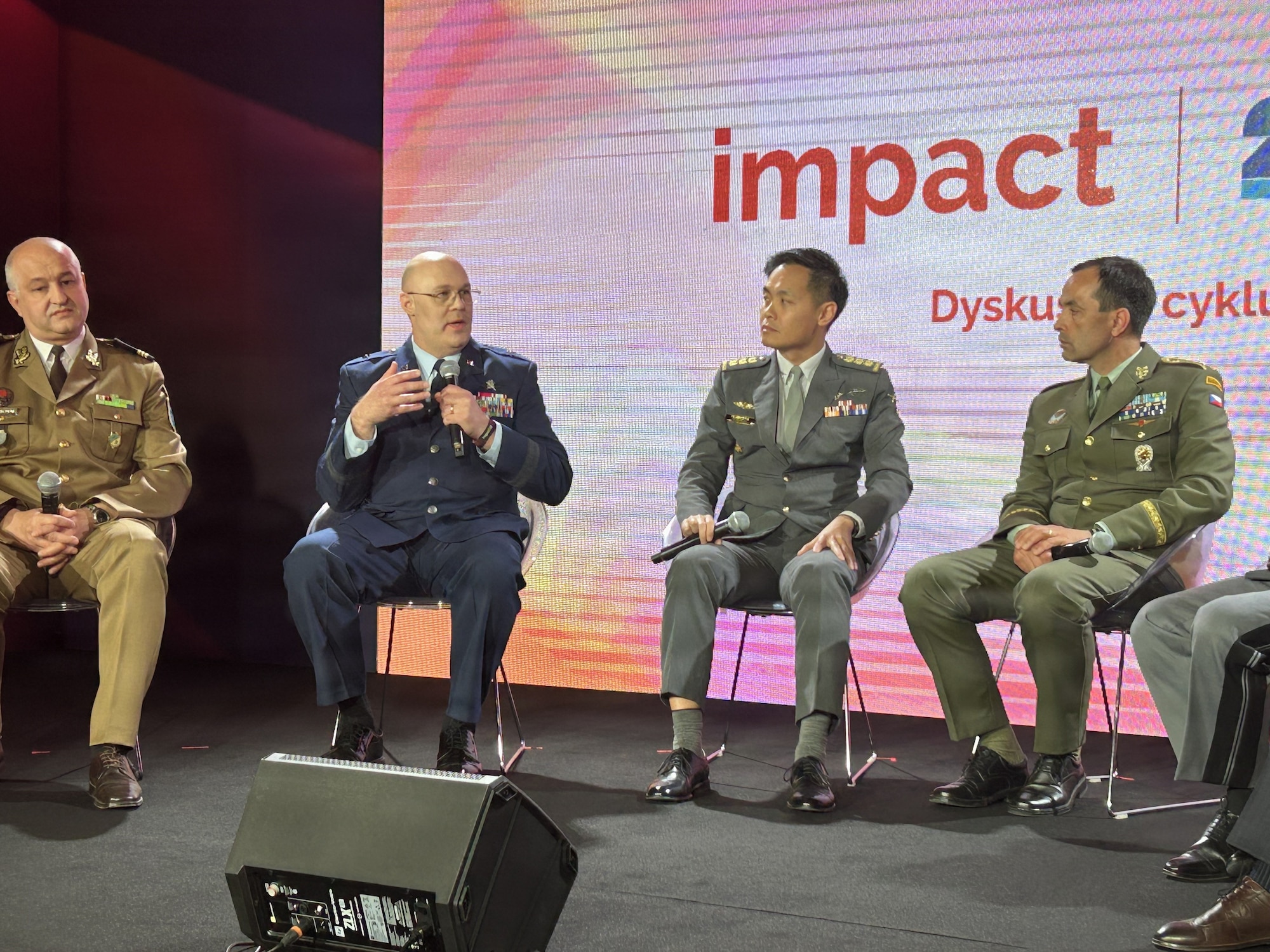 U.S. Air Force Brig. Gen. Jason Christman sits in a row, second from left, with Singapore, Czech, and Swiss leaders during a panel on the "Digital Immune Systems."