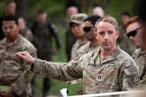 U.S. Army Capt. Harold McMurrin, commander, “Demon” Battery, Field Artillery Squadron, 2nd Cavalry Regiment points to the terrain model during the Combined Arms Rehearsal part of the Saber Strike exercise on May 5, 2026 at Bemowo Piskie Training Area, Poland. From April 27 to May 31, 2026 U.S. and Allied forces will exercise NATO’s Eastern Flank Deterrence Initiative, demonstrating NATO’s ability to fight and win on the modern battlefield. Nearly 15,000 troops from eleven nations will train across the High North, Baltic region, and Poland, executing rapid maneuvers, air defense, counter-drone operations, and cyber defense to validate NATO’s regional defense plans in real time. This series of linked exercises, including Saber Strike, Immediate Response, and Swift Response, turns investment into capability. Soldiers integrate unmanned systems, AI-enabled command and control, and live data networks to move faster, decide faster, and fight more effectively across all domains. Sword 26 demonstrates how U.S. Army Europe and Africa drives transformation at scale while strengthening deterrence. Together with our Allies, we are building a unified, lethal force ready to defend NATO territory and respond to any threat. (U.S. Army Reserve photo by Staff Sgt. Emilie Lenglain)