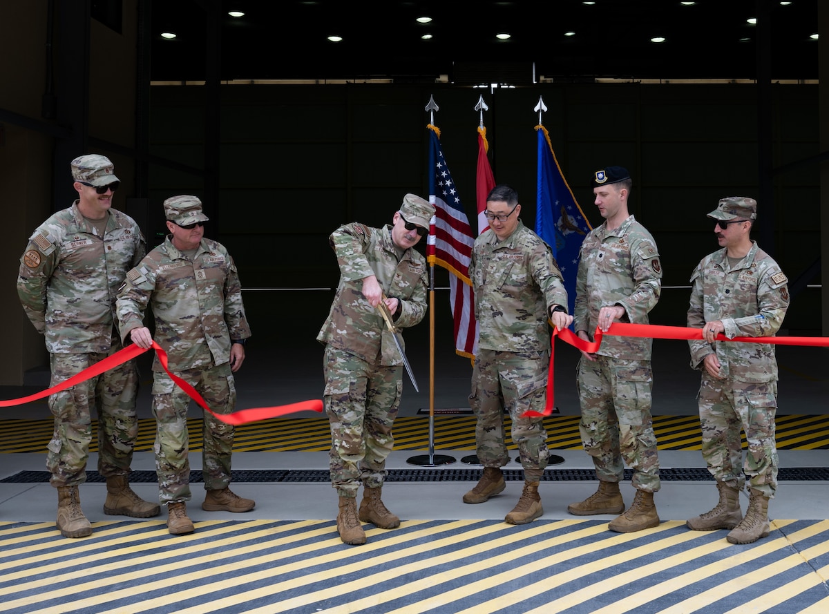 Air Force members cut a ribbon