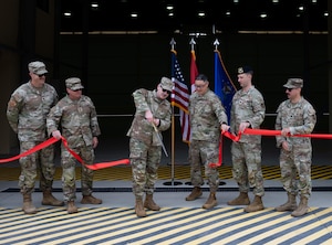 Air Force members cut a ribbon
