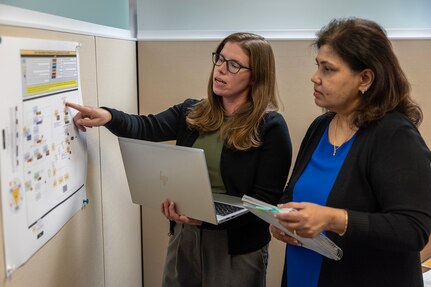 Amanda McCoy, U.S. Army Financial Management Command Army Accounting and Audit Operations supervisory accountant, left, works with Esther Richard, USAFMCOM A3O accountant, at the Maj. Gen. Emmett J. Bean Federal Center Sept. 5, 2025. McCoy and Richard were part of a five-person team who received a financial management award from the Under Secretary of Defense (Comptroller) for their efforts that supported the Army’s downgrade of its material weakness for Fund Balance with Treasury, the first material weakness to be downgraded in the Army’s General Fund. (U.S. Army photo by Mark R. W. Orders-Woempner)