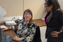 Shannon Tabbert, U.S. Army Financial Management Command Army Accounting and Audit Operations financial management analyst, left, works with Tamika McMillan, USAFMCOM A3O accountant, at the Maj. Gen. Emmett J. Bean Federal Center Sept. 5, 2025. Tabbert and McMillan were part of a five-person team who received a financial management award from the Under Secretary of Defense (Comptroller) for their efforts that supported the Army’s downgrade of its material weakness for Fund Balance with Treasury, the first material weakness to be downgraded in the Army’s General Fund. (U.S. Army photo by Mark R. W. Orders-Woempner)