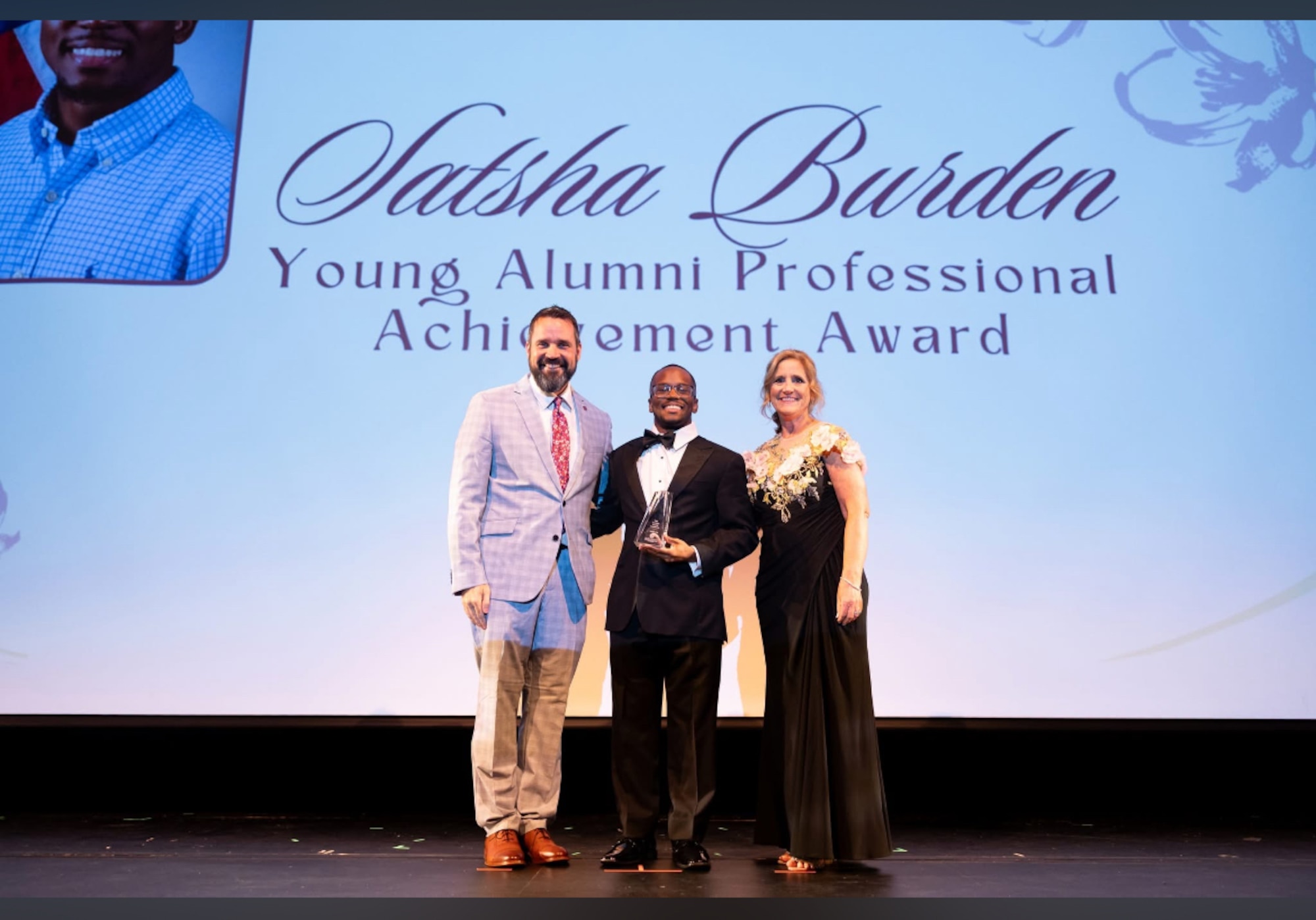 Satsha Burden, center, receives his Young Alumni Professional Achievement Award from the Northwest Mississippi Community College Foundation April 18, 2026, at the college. Burden is a test engineer and test manager for the 716th Test Squadron Store Separation Group at Arnold Air Force Base, Tenn., headquarters of Arnold Engineering Development Complex. He attended Northwest Mississippi Community College from 2017 to 2020 and began his career at Arnold in 2022. (Courtesy photo)
