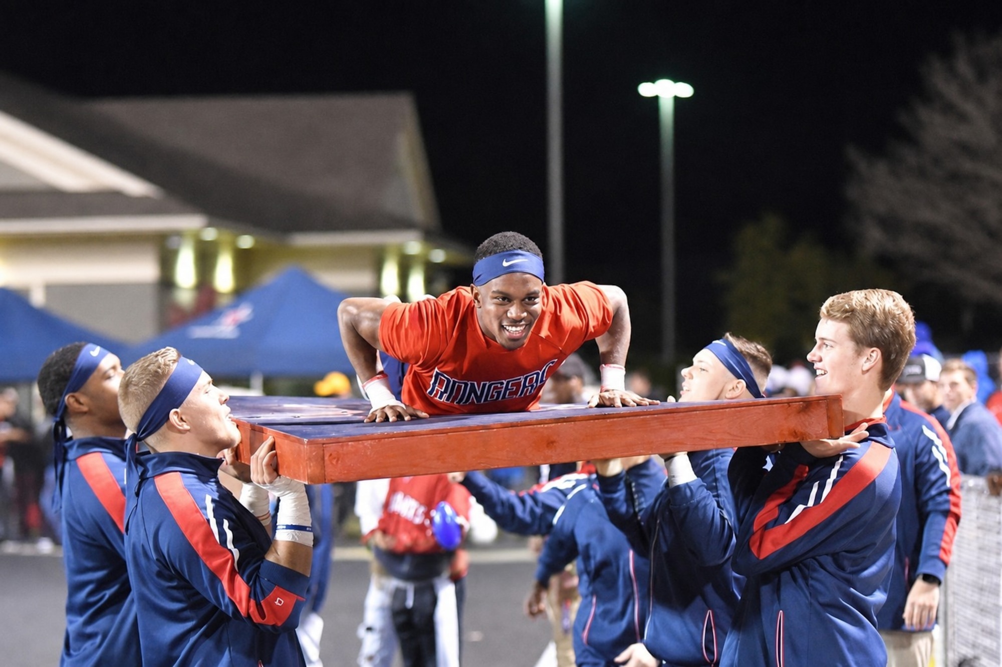 Satsha Burden, center, prepares to hype up the crowd during his time as a student at Northwest Mississippi Community College. Burden was a member of the school’s cheerleading squad. Burden is now a test engineer and test manager for the 716th Test Squadron Store Separation Group at Arnold Air Force Base, Tenn., headquarters of Arnold Engineering Development Complex. Burden was recently named the recipient of the 2026 Northwest Mississippi Community College Foundation Young Alumni Professional Achievement Award. He began his career at Arnold in 2022. (Courtesy photo)
