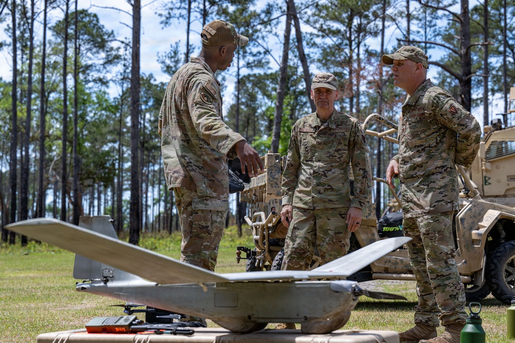 Military members talking about a SUAS drone.