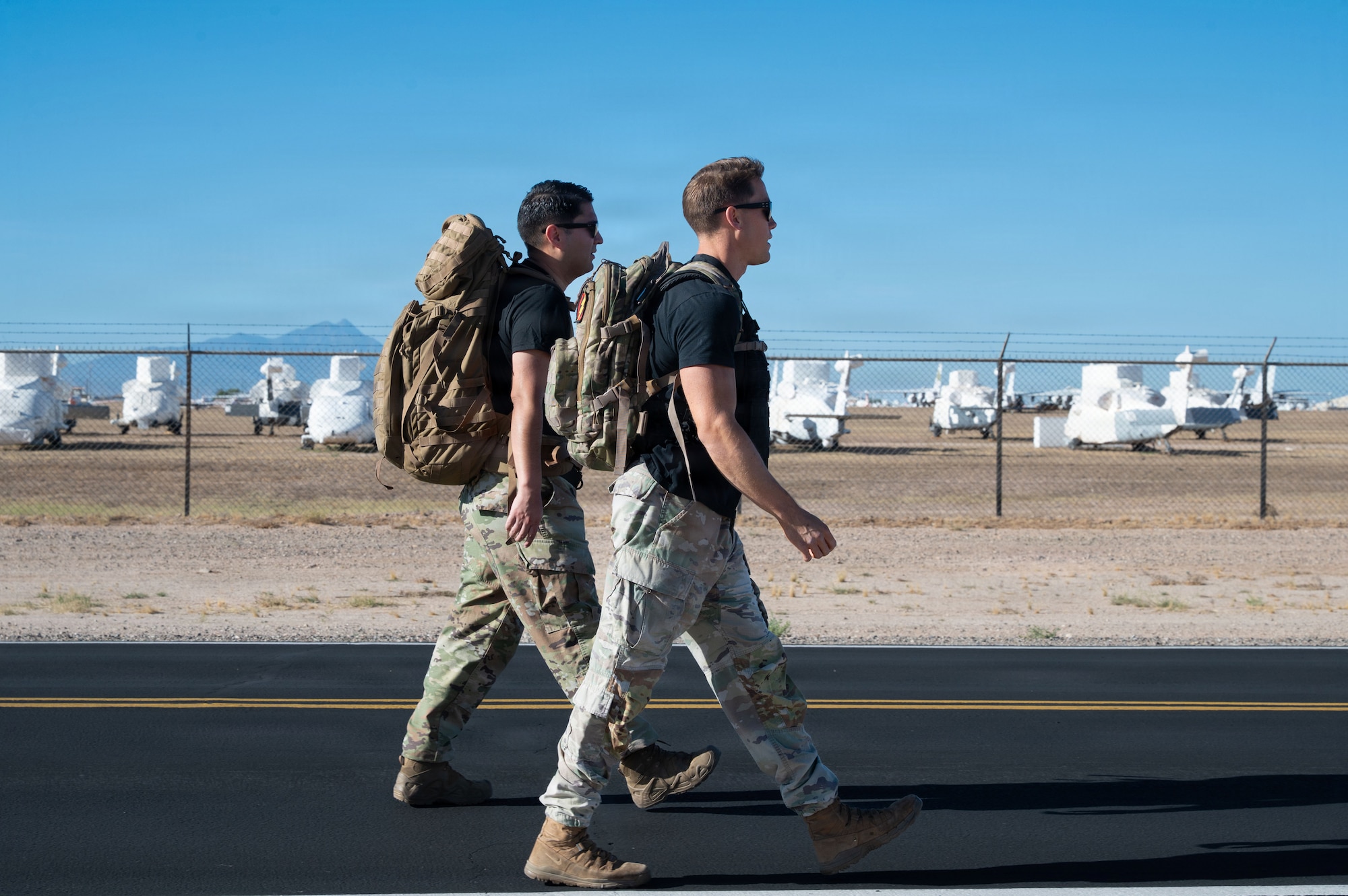 U.S. Air Force Airmen assigned to the 355th Security Forces Squadron walk during Police Week ruck at Davis-Monthan Air Force Base, Arizona, May 18, 2026. The Police Week ruck honors those who gave their lives defending our nation and reflects the commitment to remain ready, resilient, and prepared to carry on the mission. (U.S. Air Force photo by Airman 1st Class Rachael Wright)
