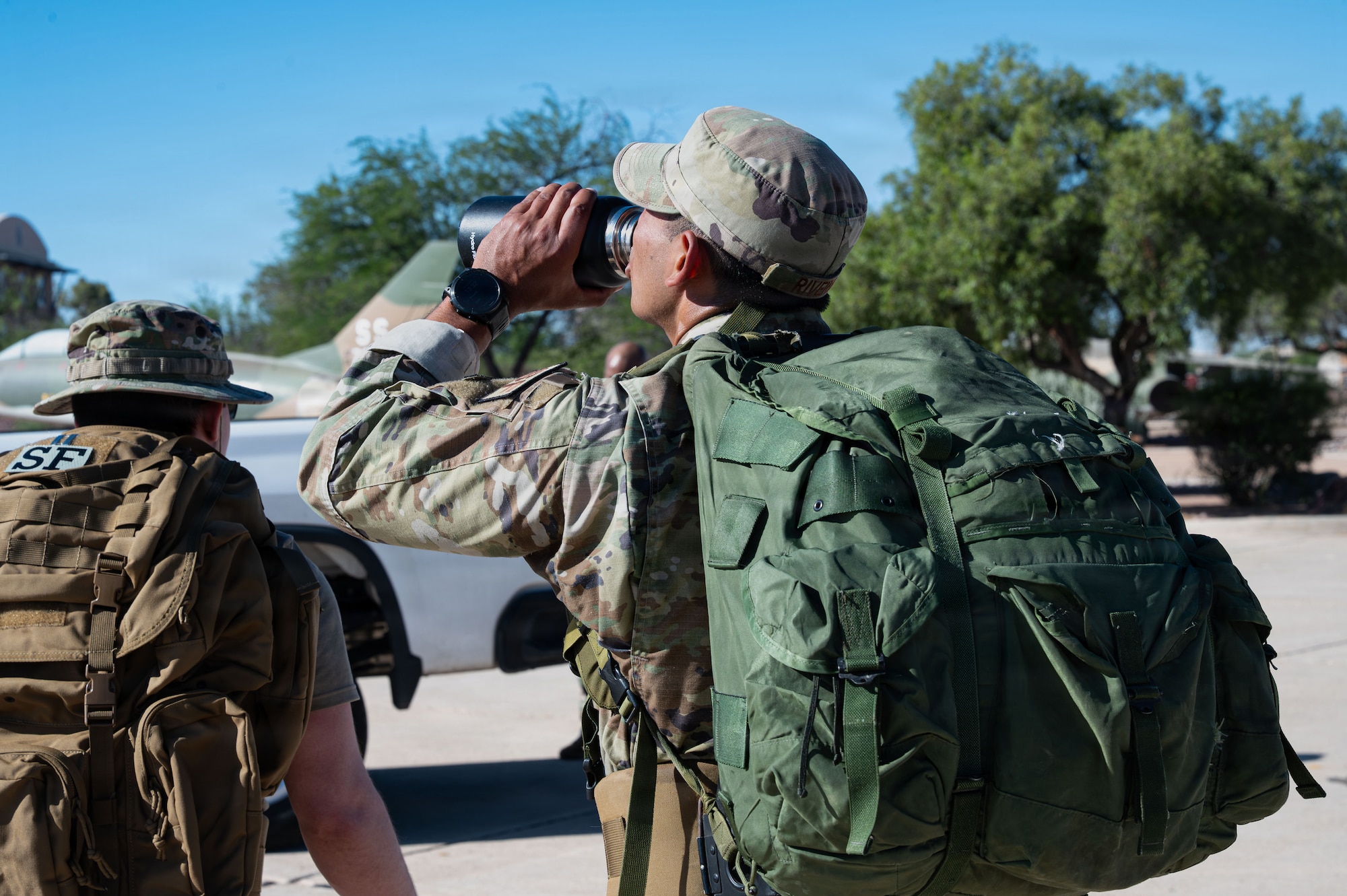 U.S. Air Force Tech Sgt. Edwin Rivera, 355th Security Forces Squadron flight sergeant, hydrates before the Police Week ruck at Davis-Monthan Air Force Base, Arizona, May 18, 2026. Police Week events highlight continual readiness while sustaining the mission and honoring those who served our nation. (U.S. Air Force photo by Airman 1st Class Rachael Wright)
