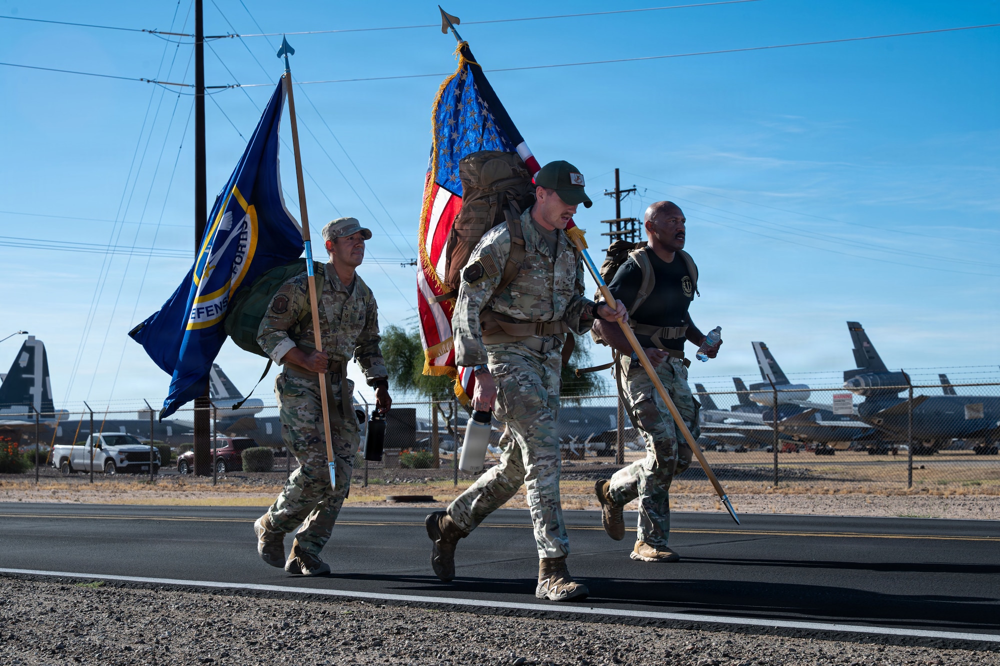 U.S. Air Force Chief Master Sgt. Kelvin Hatcher, 355th Wing command chief, Tech Sgt. Edwin Rivera and Tech Sgt. Logan Carpenter, 355th Security Forces Squadron flight sergeants, run during the Police Week ruck at Davis-Monthan Air Force Base, Arizona, May 18, 2026. The Police Week ruck featured a four-mile walk, demonstrating an enduring commitment to defending our nation. (Photo by U.S. Air Force Airman 1st Class Rachael Wright)