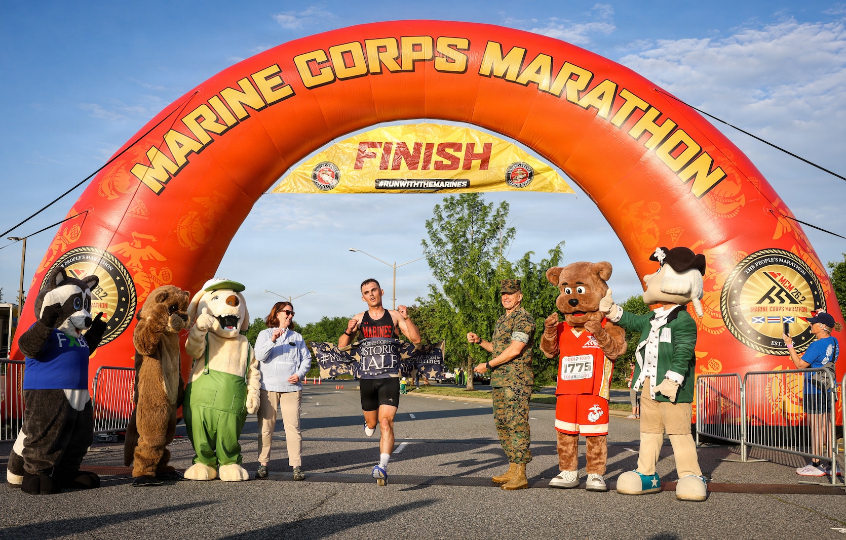 Naphtali Moulton, the male first-place runner, crosses the finish line during the 2026 Marine Corps Historic Half in Fredericksburg, Virginia, May 17, 2026. The Historic Half is a 13.1-mile race weaved throughout Historic Downtown Fredericksburg, home to over 200 businesses and several historic sites. The annual race generates community goodwill, fosters public relations, and increases advocacy for individual health while emphasizing the Marine Corps’ warrior ethos. (U.S. Marine Corps photo by Lance Cpl. Jeffery Stevens)