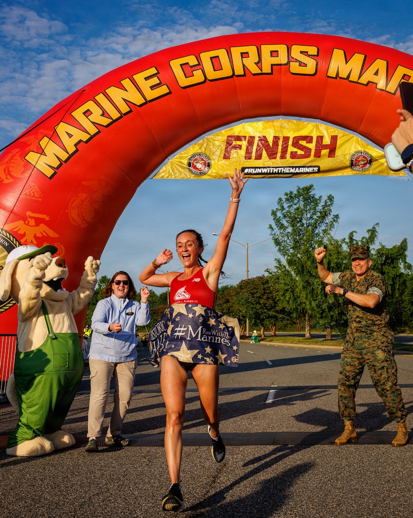Natalie Daniles, the female first-place runner, crosses the finish line during the 2026 Marine Corps Historic Half in Fredericksburg, Virginia, May 17, 2026. The Historic Half is a 13.1-mile race weaved throughout Historic Downtown Fredericksburg, home to over 200 businesses and several historic sites. The annual race generates community goodwill, fosters public relations, and increases advocacy for individual health while emphasizing the Marine Corps’ warrior ethos. (U.S. Marine Corps photo by Lance Cpl. Jeffery Stevens)