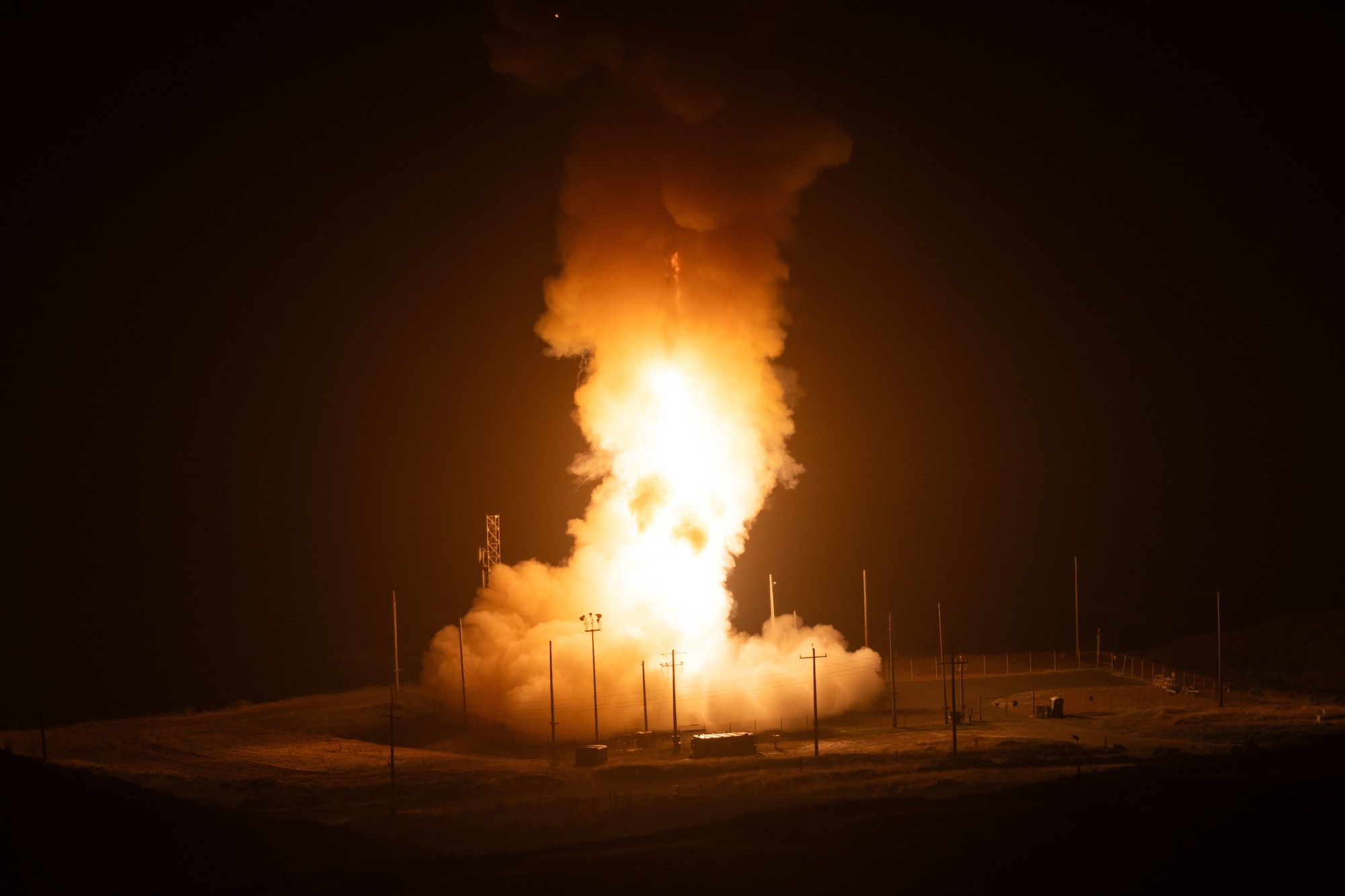 A rocket lights up the night sky.