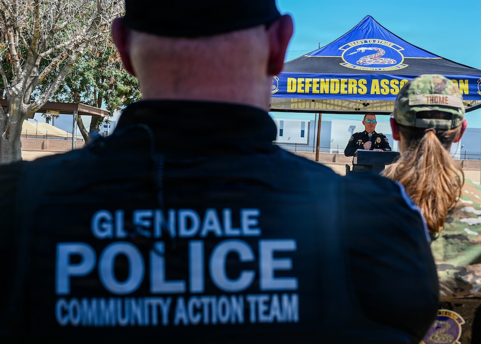 Jay O’Neill, Glendale Police Department special operations division commander, center, speaks at a closing ceremony for 2026 Police Week held at Luke Air Force Base, Arizona, May 15, 2026. O’Neill was invited to be the guest speaker for the ceremony in part due to his prior service as a U.S. Marine and long-standing career as a civilian law enforcement officer, embodying the unmatched spirit of service shared between Luke AFB and local community. (U.S. Air Force photo by Staff Sgt. Magen M. Reeves)