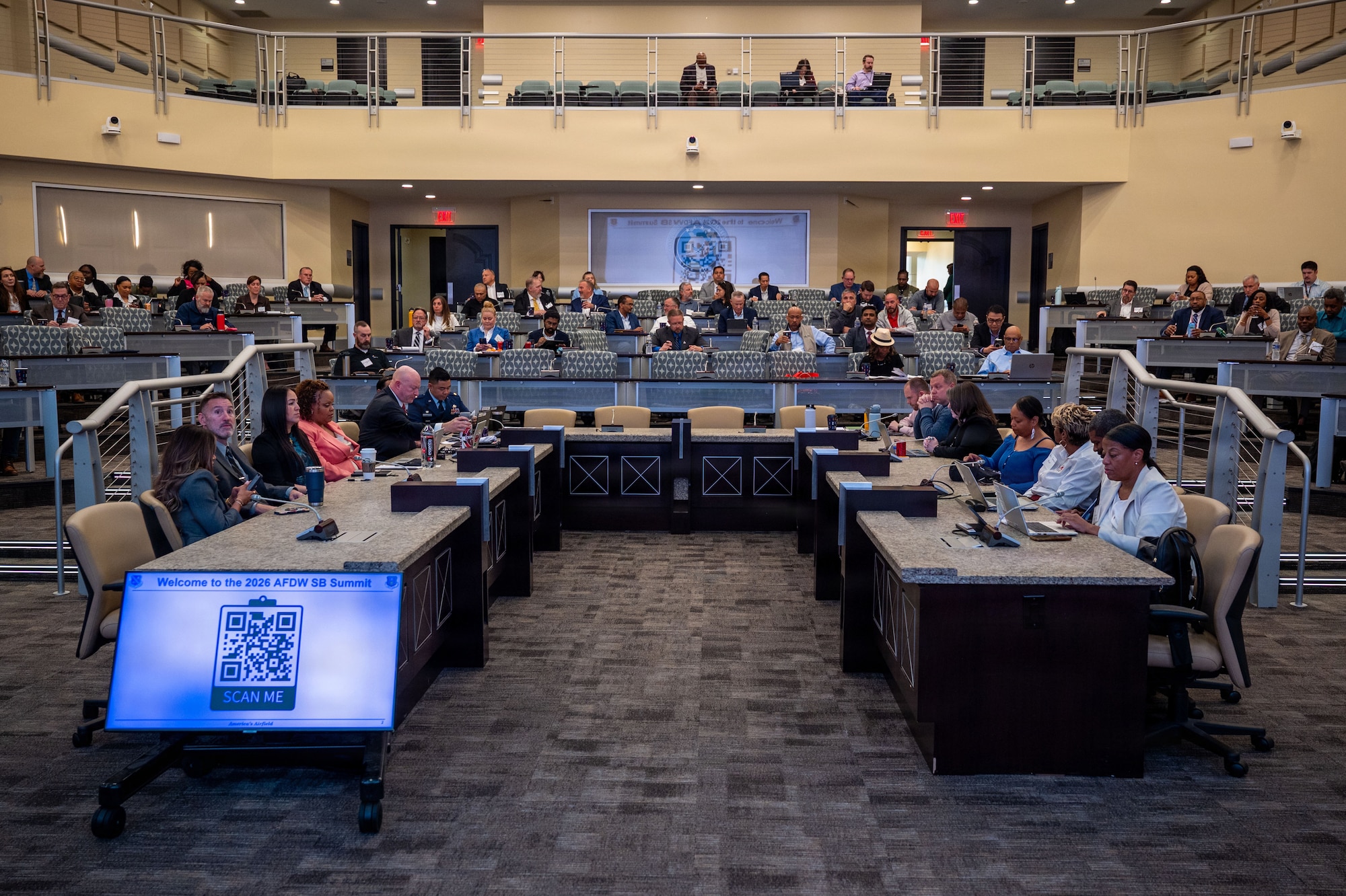 People sitting in a conference room.