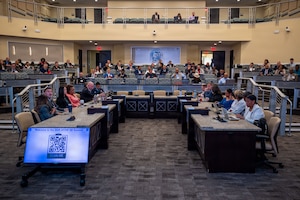 People sitting in a conference room.