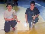 (L) Air Force Senior Master Sgt. Joseph Lathwood, Portland, Maine MEPS SEA (pictured with his brother) began wrestling in elementary school. Lathwood was selected to coach at the 2026 Armed Forces Wrestling Championship.