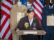 Capt. Richard "Dick" Nelms, a 103-year-old World War II B-17 pilot, addresses attendees during the B-17 Alliance Foundation's Armed Forces Day Celebration at Salem McNary Airfield in Salem, Oregon, May 16, 2026. Nelms, wearing his 8th Air Force veteran's cap and flight jacket, completed 35 combat missions over occupied Europe with the 447th Bombardment Group (Heavy) between May and September 1944.