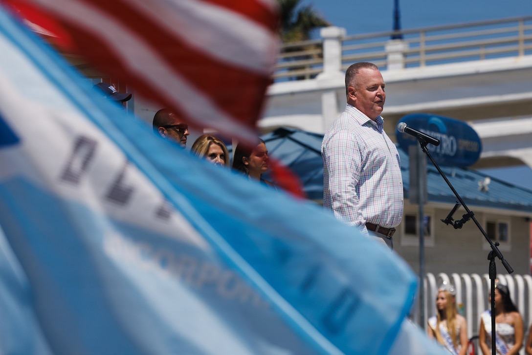 U.S. Marine Corps Col. Dudik, deputy commander of Marine Corps Installations West, Marine Corps Base Camp Pendleton, delivers remarks during the Armed Forces Day Operation Appreciation event in Oceanside, Calif., on May 16, 2026. Operation Appreciation honors active-duty military personnel, veterans and their families. Elected officials and representatives from all levels of government welcomed service members to the celebration. (U.S. Marine Corps photo by Sgt. Fourmet Gustavsen)