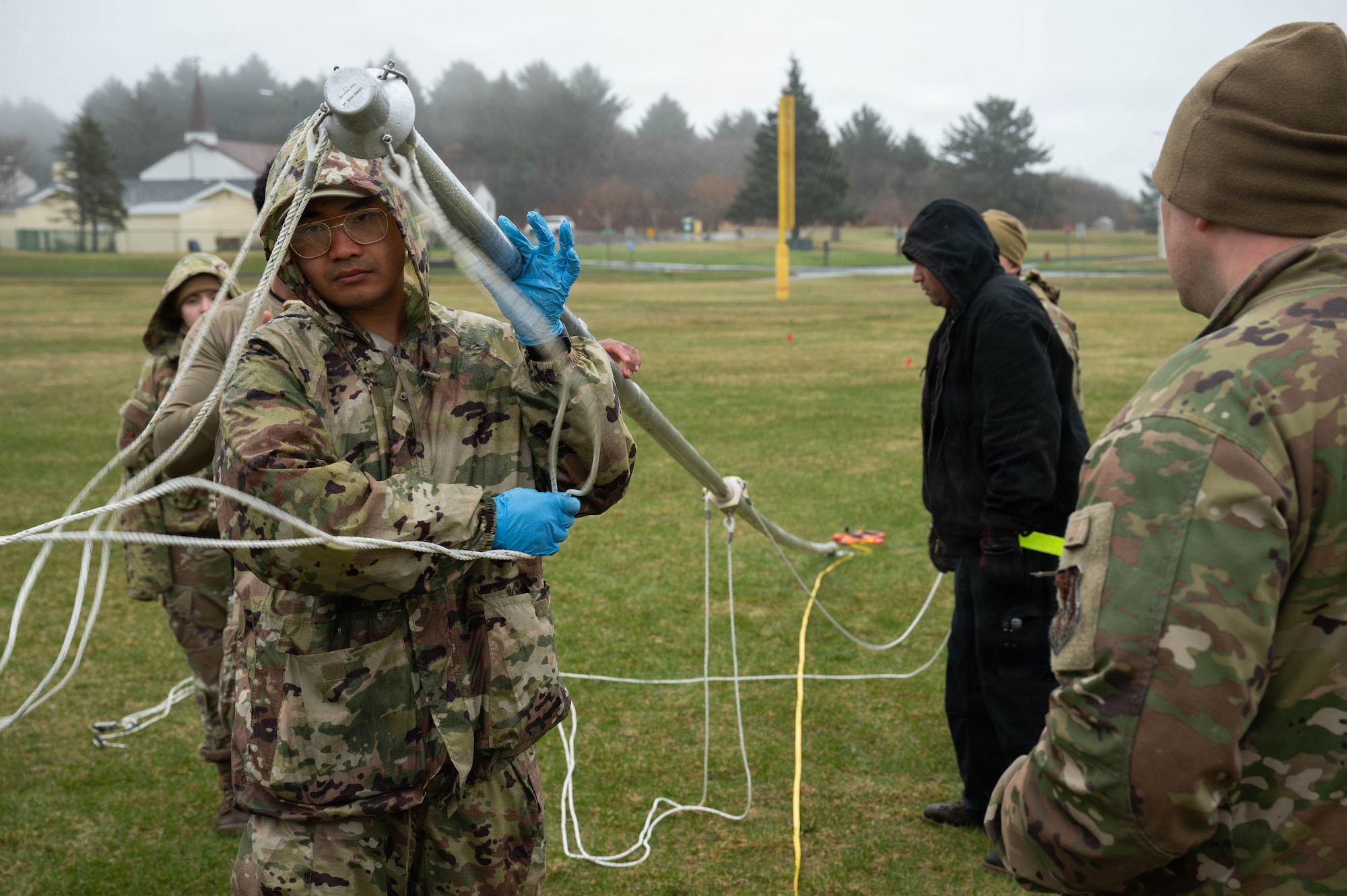 U.S. Air Force Airman 1st Class Nattapat Thawonjak, 773d Civil Engineer Squadron power production journeyman, assists in the construction of a communication antenna during exercise Tropic Tundra 26 at Coast Guard Air Station Kodiak, Alaska, May 12, 2026.