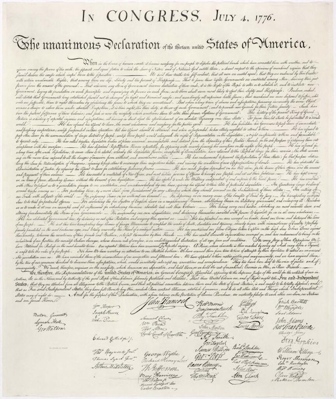 A document written in cursive with many signatures.