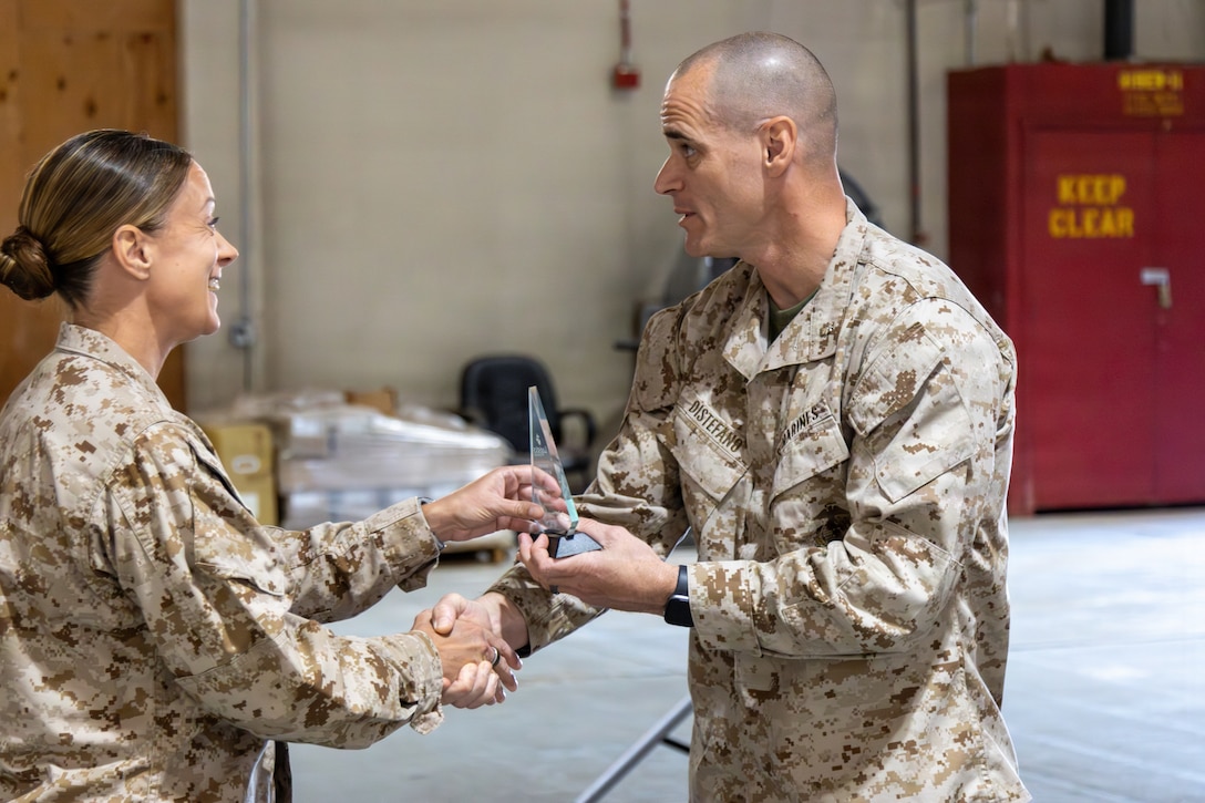 Colonel Russell Savatt, base commanding officer, and Lt. Col. Matthew DiStefano, 1st Force Storage Battalion commanding officer, welcomed Col. Sharon Dubow, Marine Force Storage Command commanding officer, for her final on deck tour at the Yermo Annex and Mounted Color Guard Stables before relinquishing MFSC command in June aboard Marine Corps Logistics Base Barstow, California, May 19.